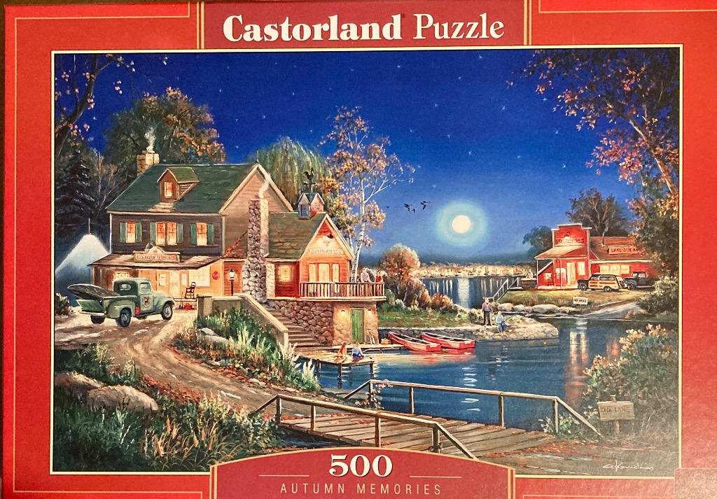 A peaceful night scene of a lakeside inn under a full moon with red canoes and an old truck parked in the yard.