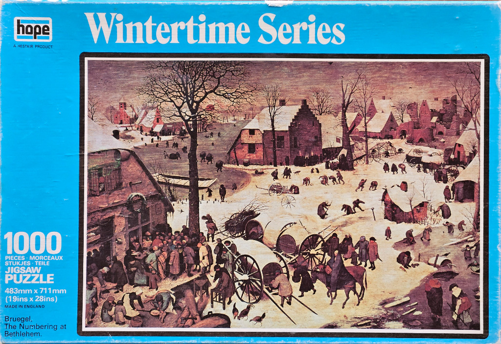 A reproduction of Pieter Bruegel the Elder's painting The Numbering at Bethlehem depicting a snowy village scene.