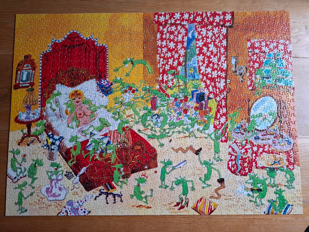 Cartoon illustration of a blonde woman in a bedroom surrounded by many small green frog-like creatures having a party.