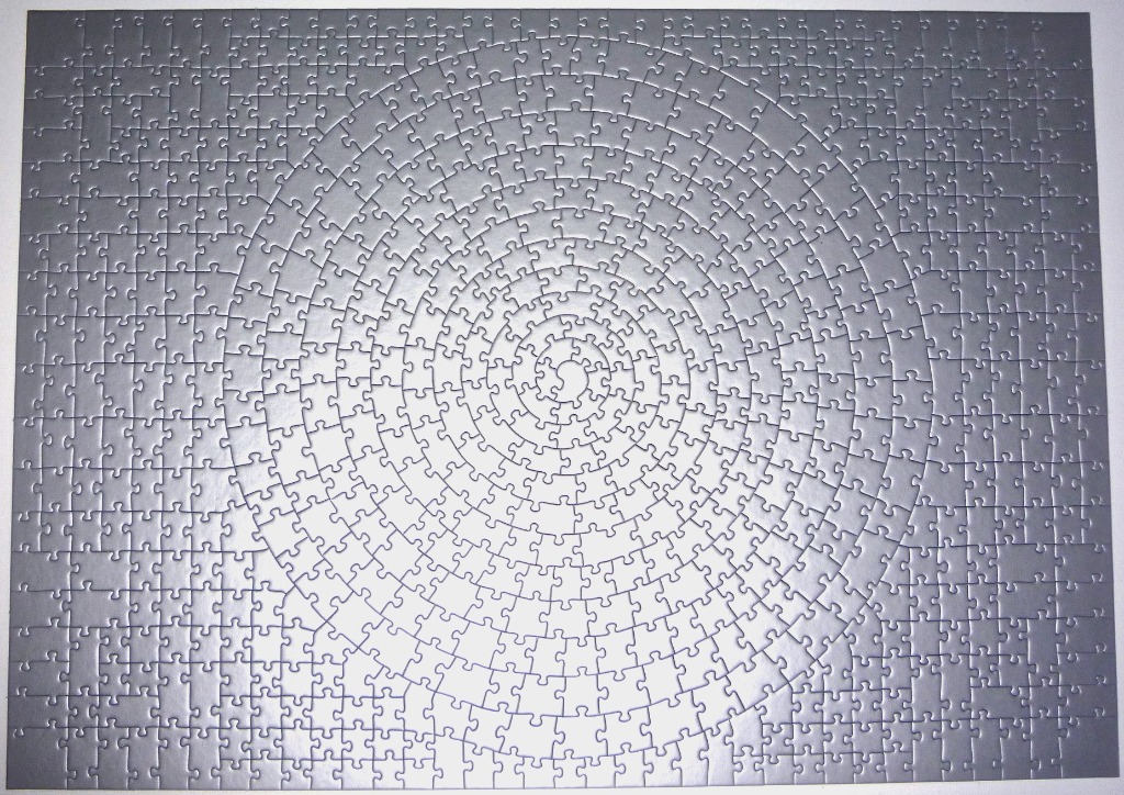 A monochromatic silver spiral pattern forming a hypnotic circular vortex against a solid grey background.