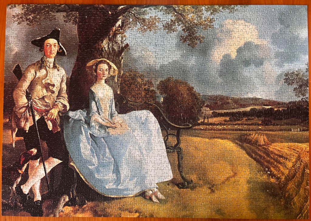 A reproduction of the painting Mr and Mrs Andrews by Thomas Gainsborough showing a couple in an 18th-century landscape.
