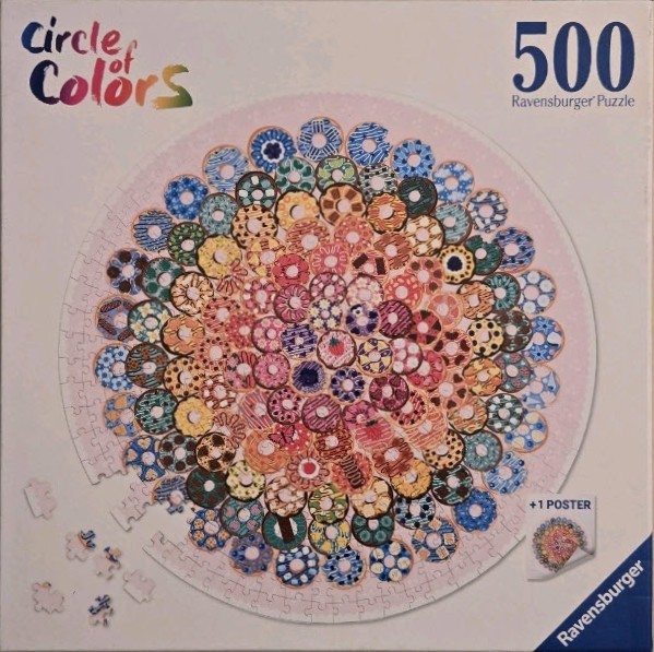 A circular arrangement of numerous colorful, decorated donuts on a light pink background.