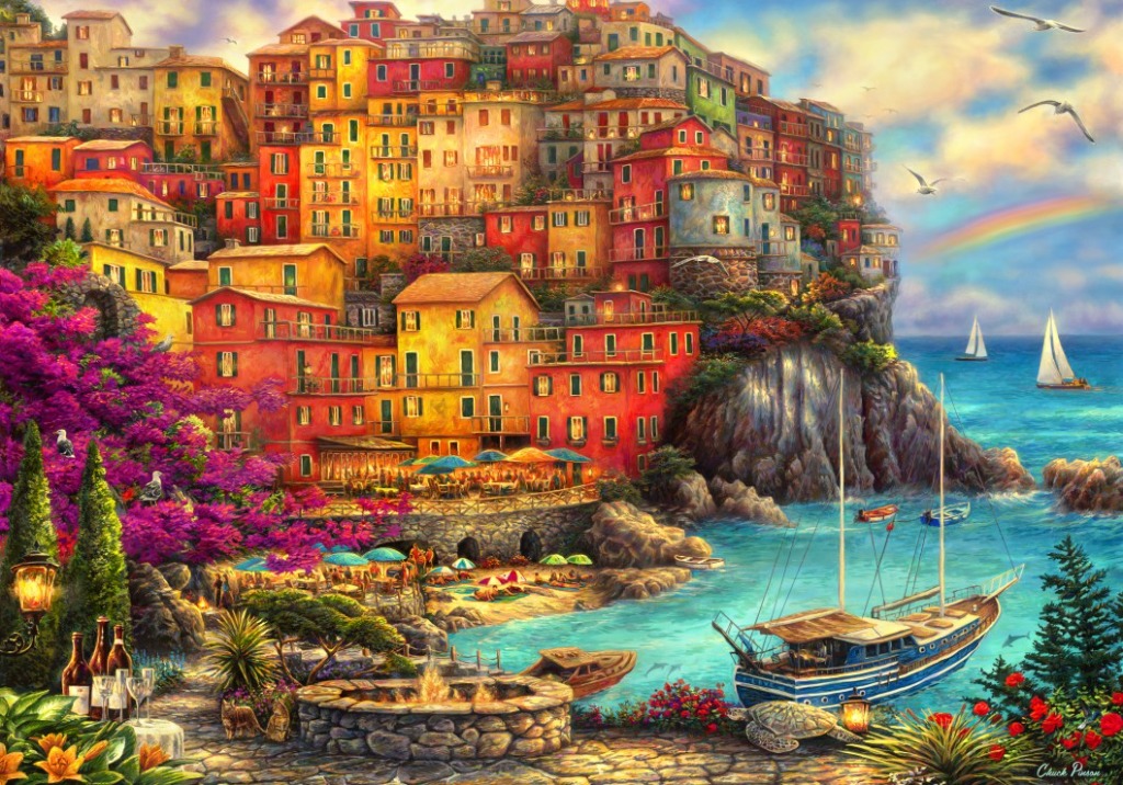 Colorful Mediterranean coastal village nestled on cliffs above a blue bay with boats