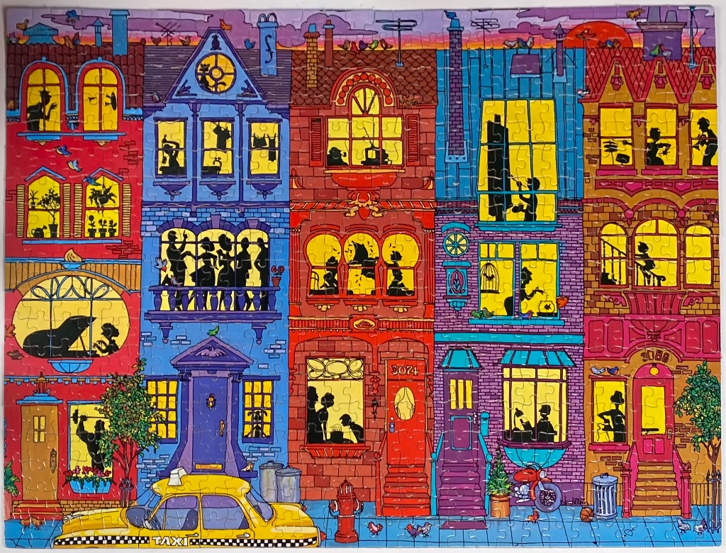 A vibrant, stylized illustration of a row of colorful urban townhouses filled with silhouette figures in windows.