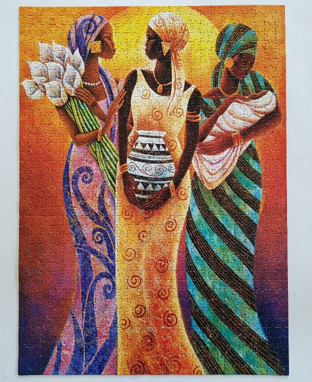 A painting of three African women in traditional attire standing against a glowing golden sun background.