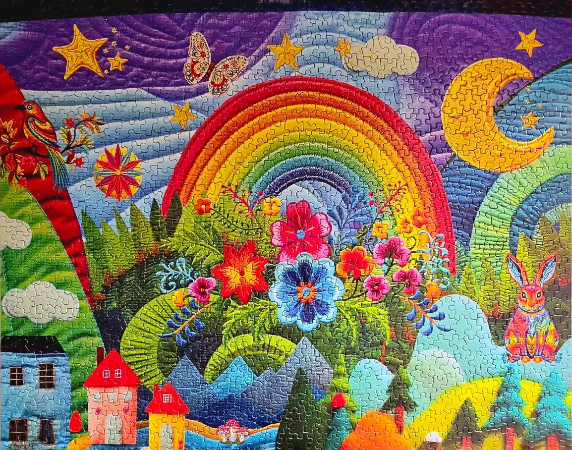 A vibrant, colorful folk art illustration featuring a rainbow, crescent moon, whimsical flowers, and a rabbit.