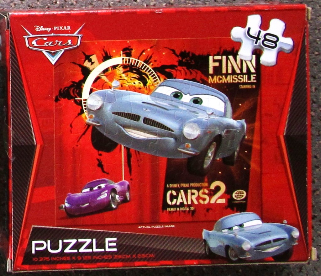 Illustration of Finn McMissile, a blue spy car, against a fiery red and black background.