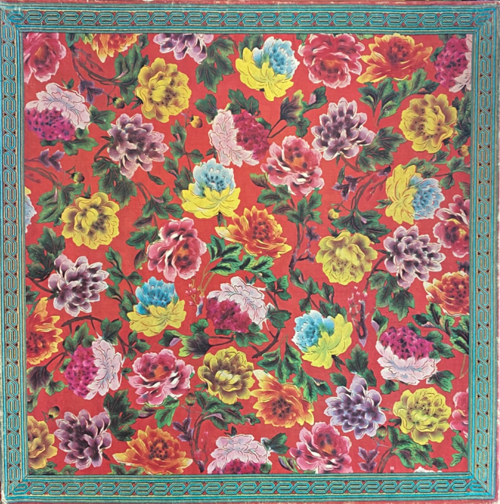 Floral pattern of vibrant peonies and foliage on a rich red background within a decorative teal border.