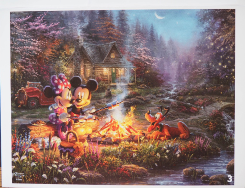 Mickey and Minnie Mouse roasting marshmallows by a campfire near a rustic cabin in the woods at night.