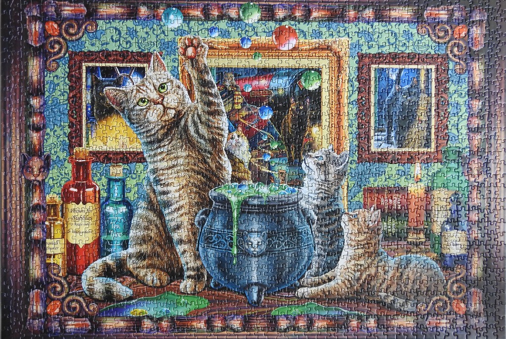 Three cats gathered around a bubbling magical cauldron with potion bottles and framed pictures in the background.