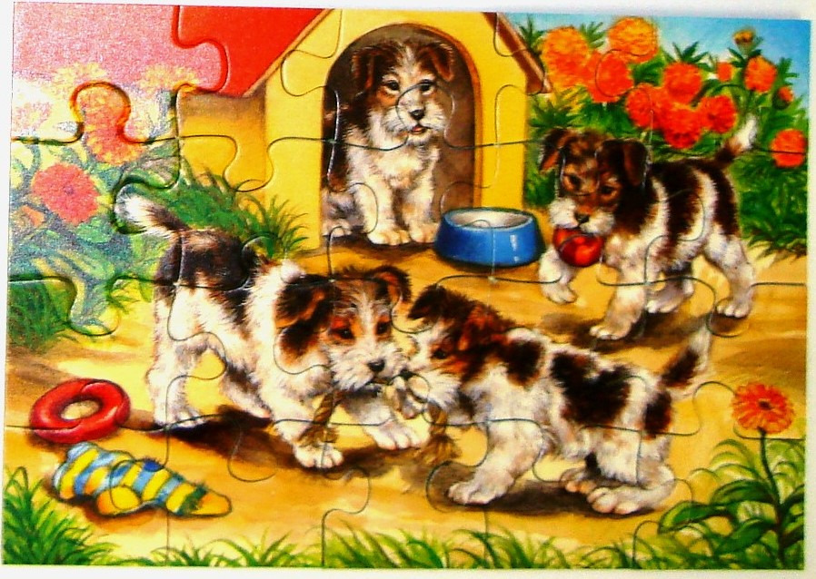 Three puppies playing around a yellow doghouse in a garden