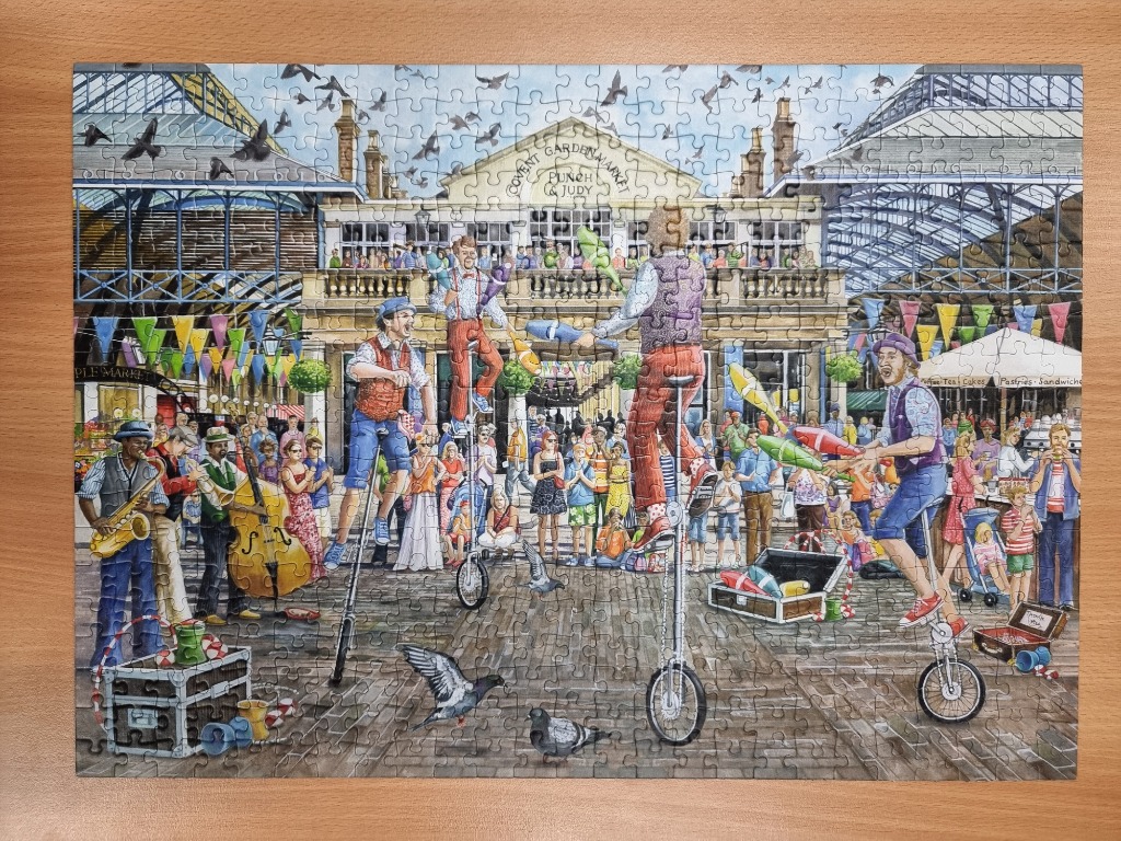 Illustration of street performers juggling on unicycles in front of Covent Garden Market.