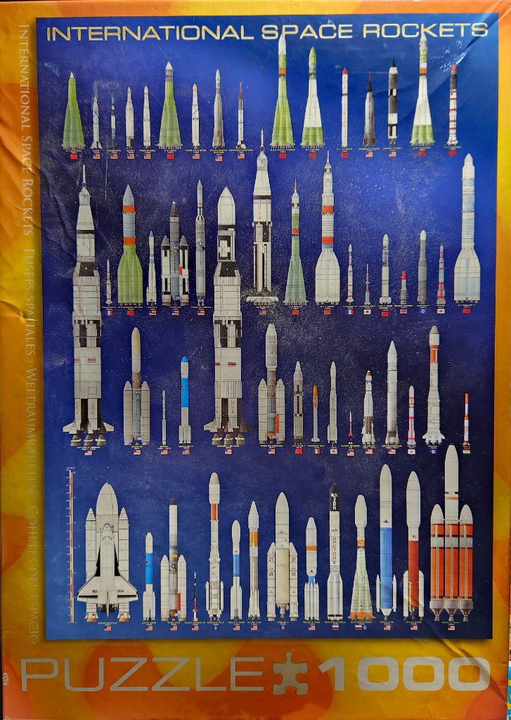 A collection of illustrated space rockets and launch vehicles arranged in rows against a deep blue background.
