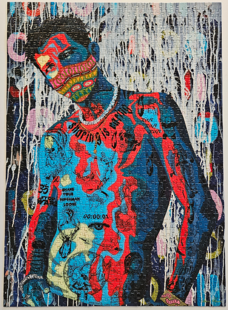 A portrait of a person with dark skin covered in vibrant, intricate neon tattoos and a patterned face mask.