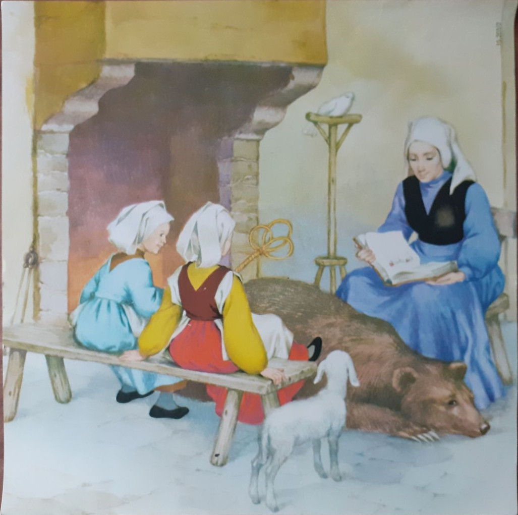 A woman in period clothing reading to two children by a fireplace with a bear and a lamb nearby.