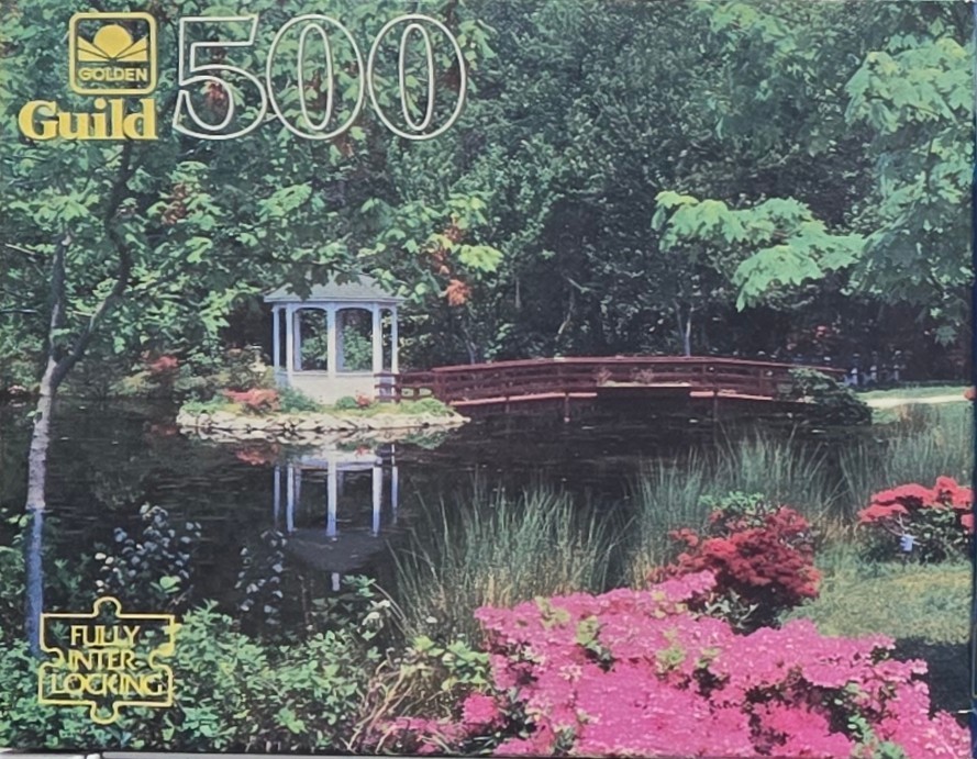A peaceful garden scene with a white gazebo, a wooden bridge, and a pond surrounded by lush greenery and pink flowers.