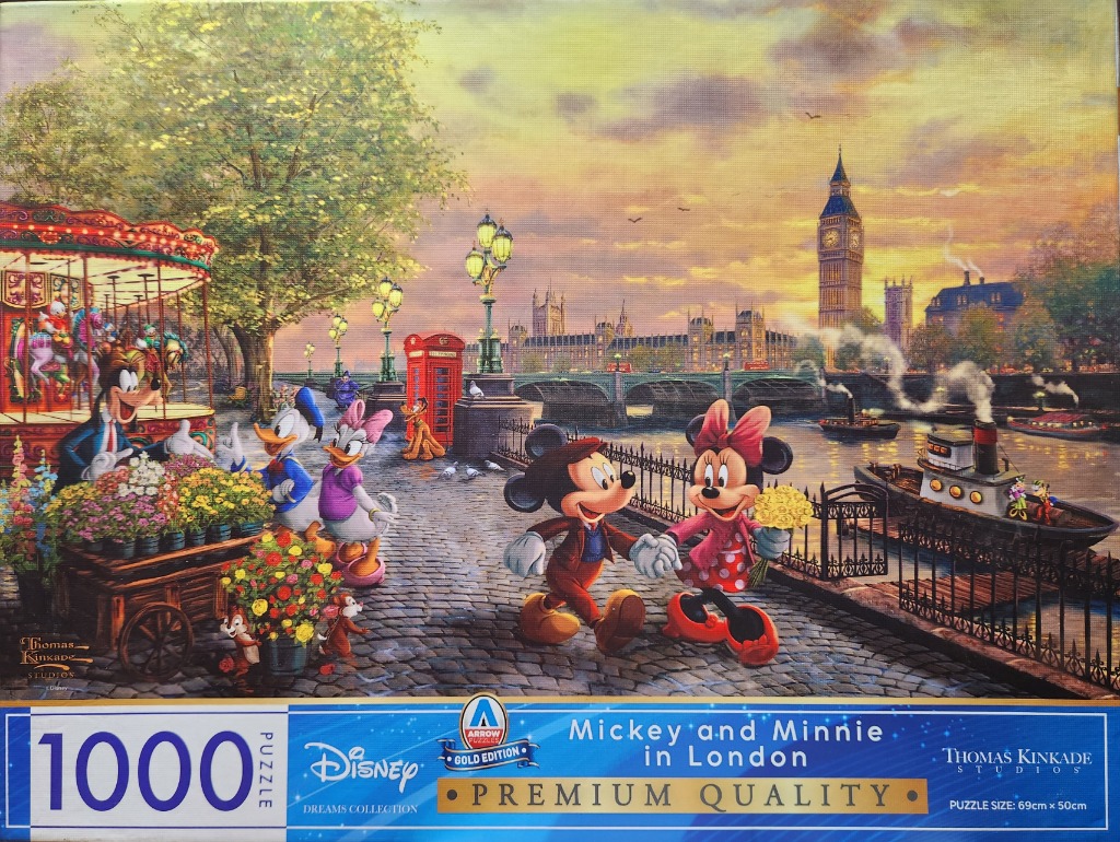 Mickey and Minnie Mouse walking along the Thames in London at sunset with other Disney characters.