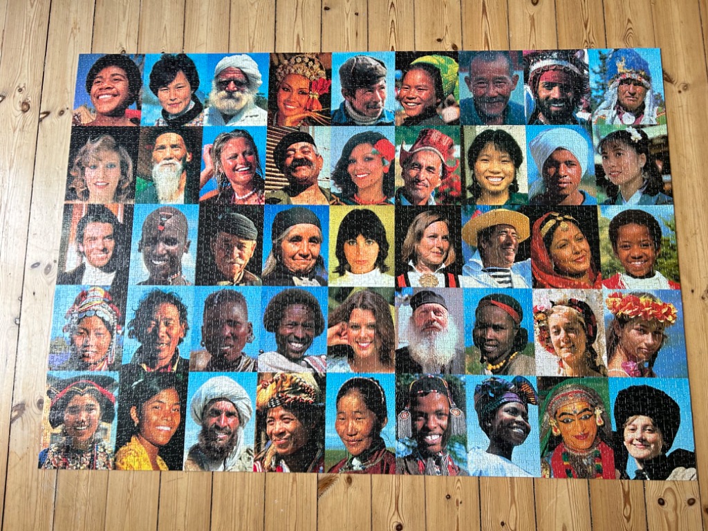 A grid of 48 individual photographic portraits of people from diverse cultures around the world.