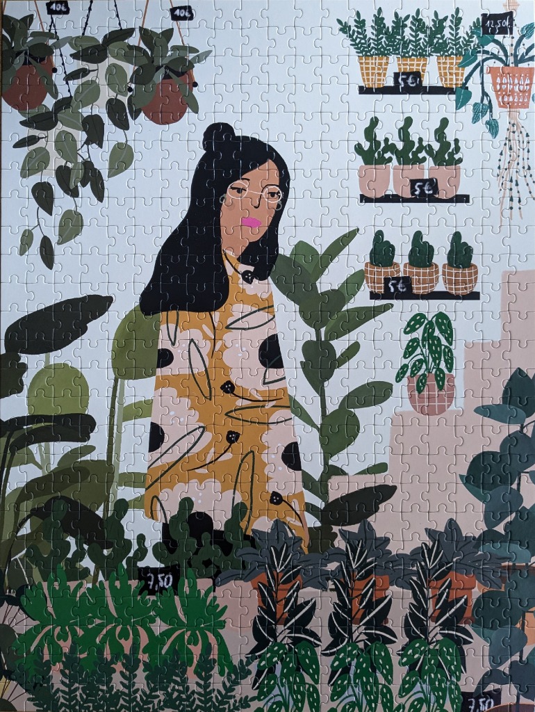An illustration of a woman standing in a plant shop surrounded by various potted houseplants and hanging greenery.