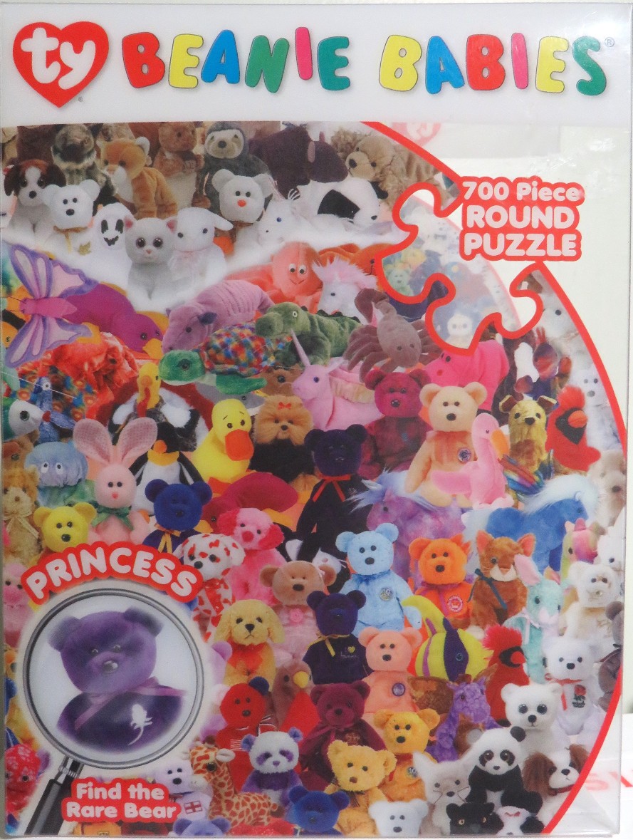 A dense collage of dozens of colorful plush beanbag animal toys piled together.