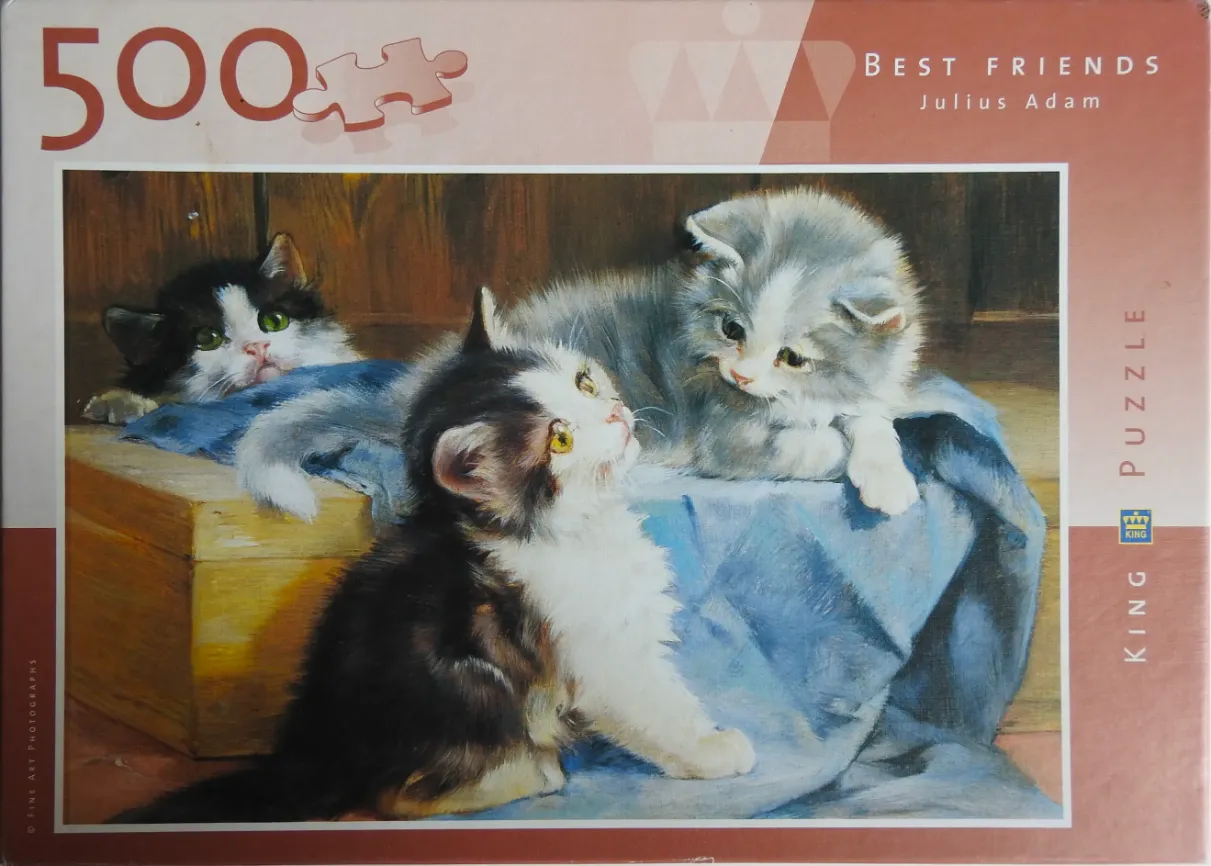 A realistic oil painting of three fluffy kittens sitting on a blue cloth-covered wooden box.