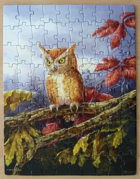 A detailed painting of a small owl perched on a branch surrounded by colorful autumn leaves.