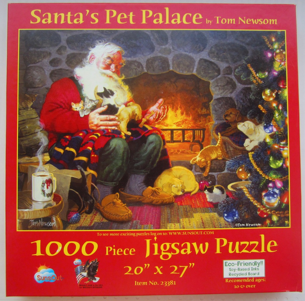 Santa Claus sitting by a stone fireplace surrounded by numerous kittens and puppies.