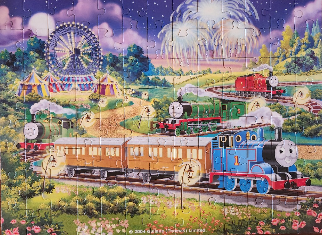 A whimsical nighttime scene featuring anthropomorphic steam trains at a carnival with fireworks in the background.