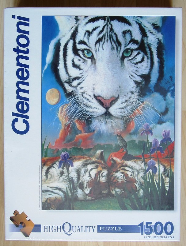 A close-up illustration of a large white tiger face hovering above two sleeping tigers in a field of irises.
