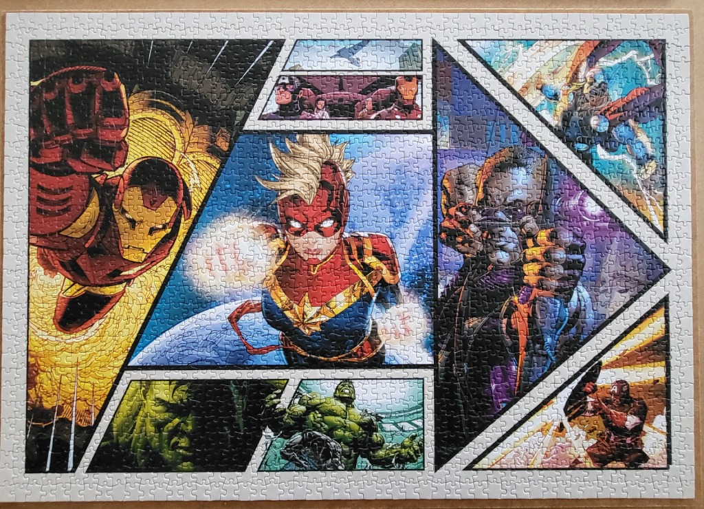 A comic book style montage of various superheroes including Iron Man, Captain Marvel, and Hulk.