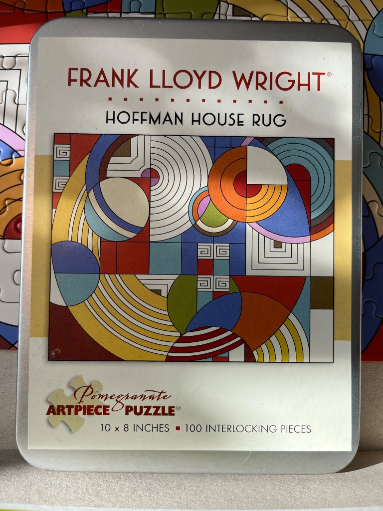 Abstract geometric pattern based on a rug design featuring circles, squares, and bold primary colors.