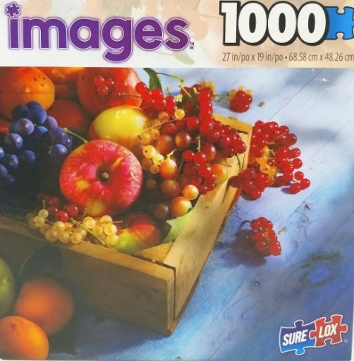 Still life of fresh colorful fruits in a wooden crate on a blue wooden table