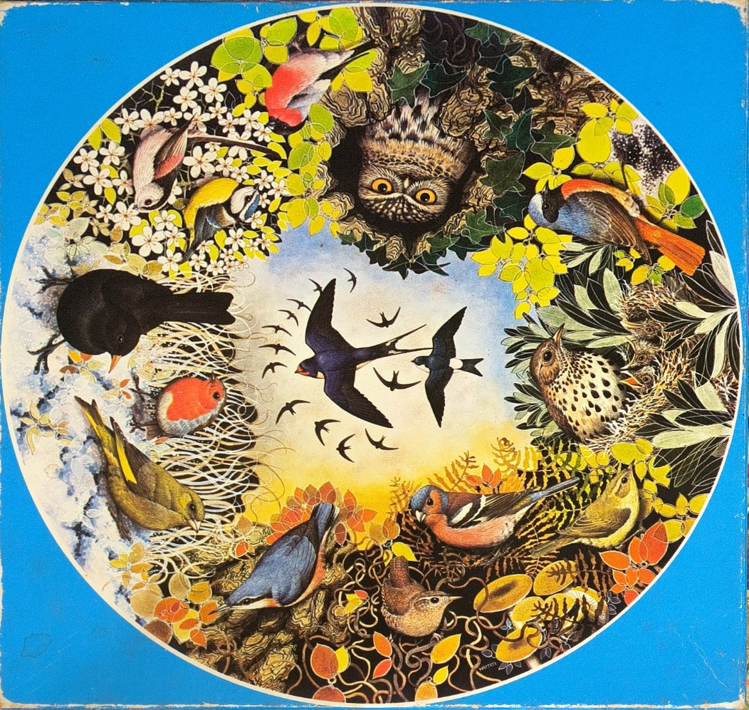Circular illustration of various birds surrounded by foliage and a central sky