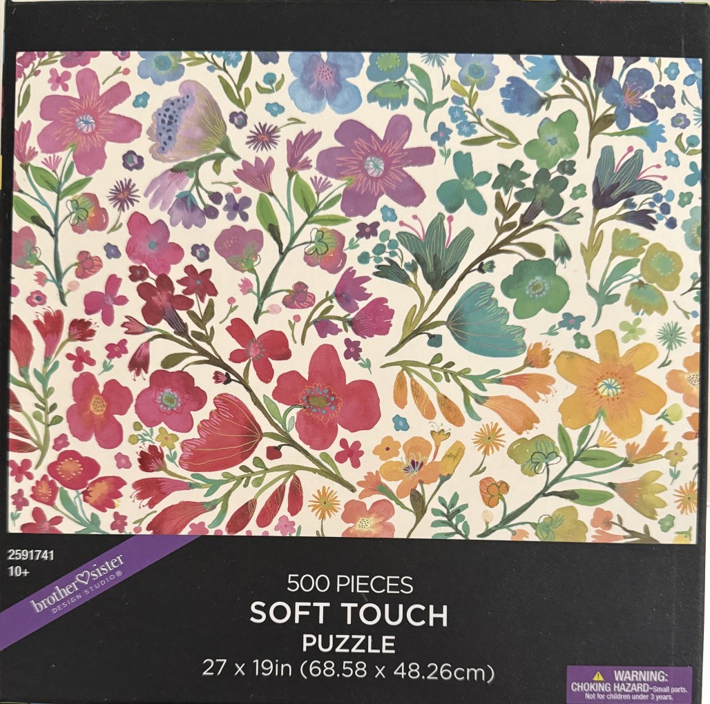 Watercolor-style botanical illustration featuring a colorful floral pattern on a cream background.
