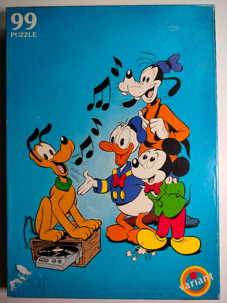 Cartoon characters Pluto, Donald Duck, Mickey Mouse, and Goofy singing around a record player against a blue background.