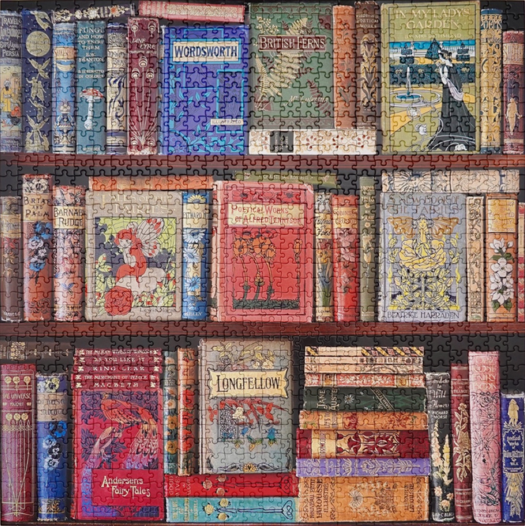 A three-tiered bookshelf filled with antique, vintage, and art nouveau style books.