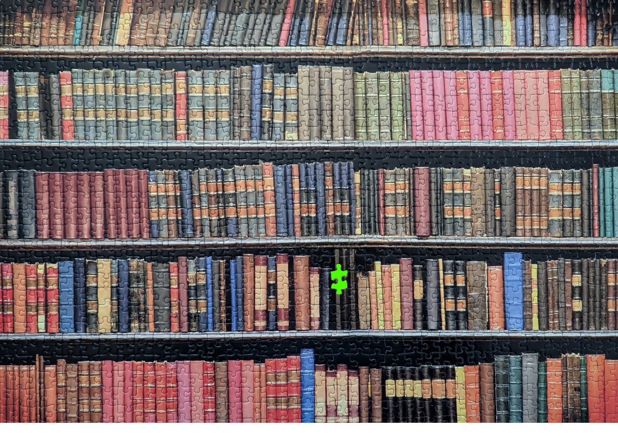 A wall of full bookshelves with a single bright green puzzle piece floating in the center.