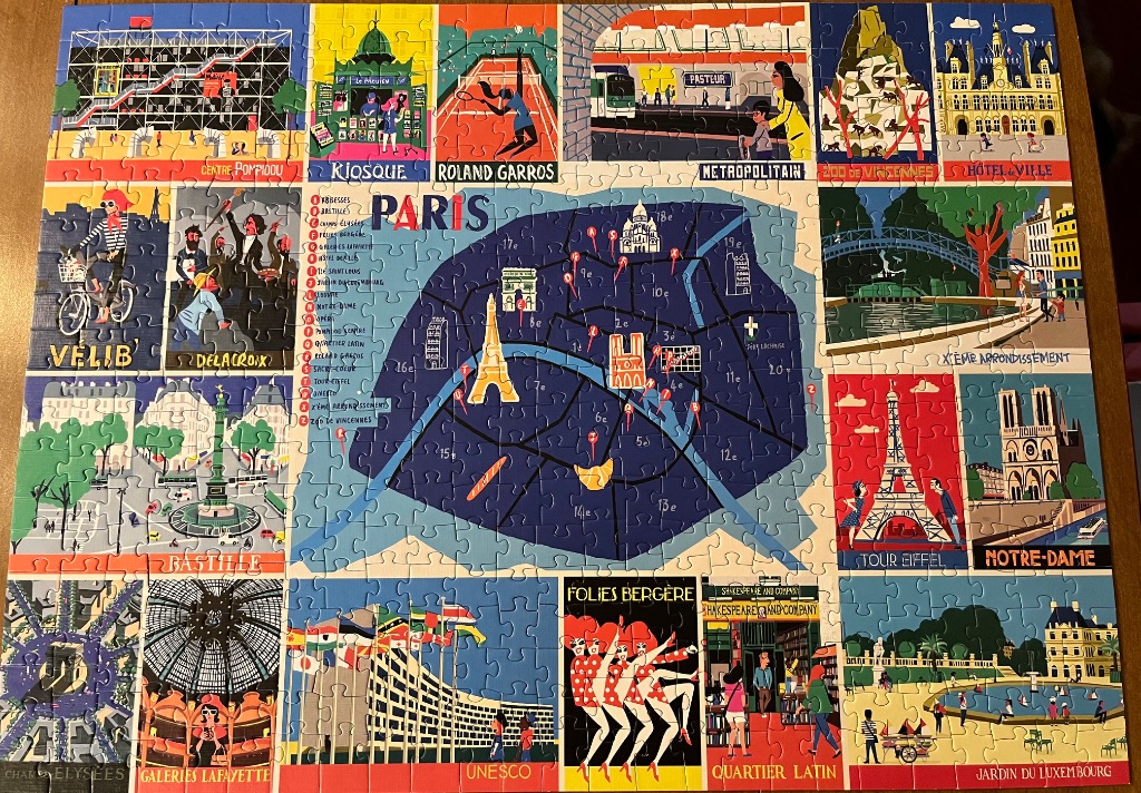 Stylized illustrated map of Paris surrounded by 20 iconic vignettes of city landmarks and culture.