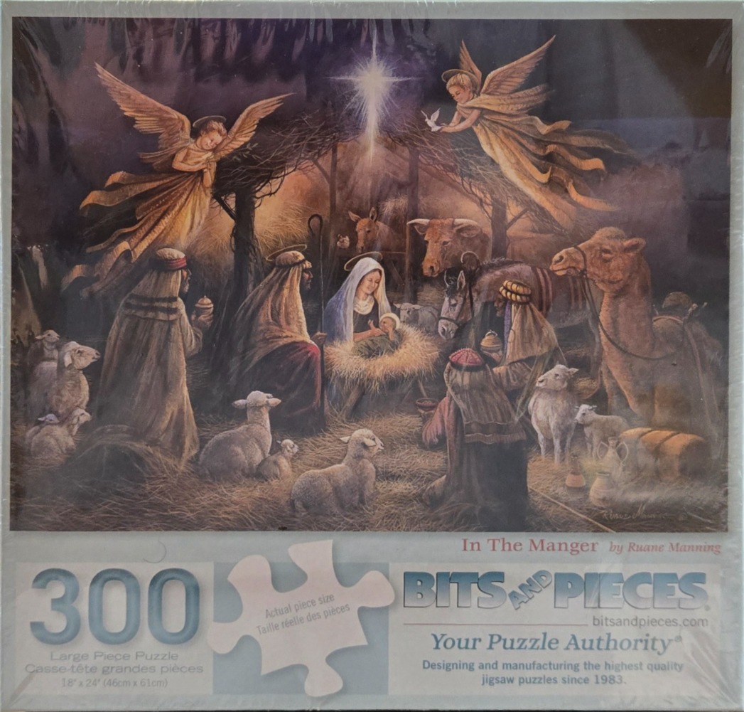 A traditional Christmas nativity scene featuring Mary, Joseph, the baby Jesus, shepherds, animals, and two angels.