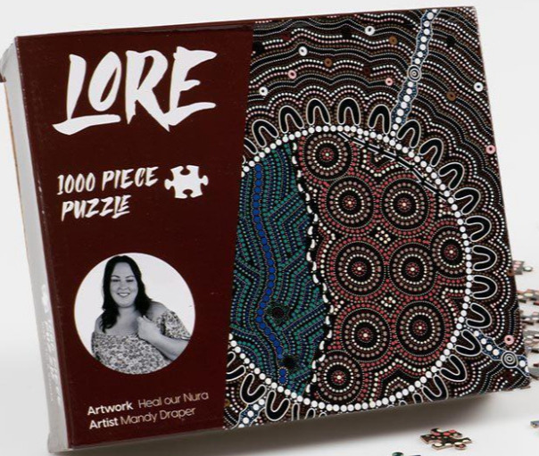 A vibrant Indigenous Australian dot painting featuring circular patterns and flowing lines against a dark background.