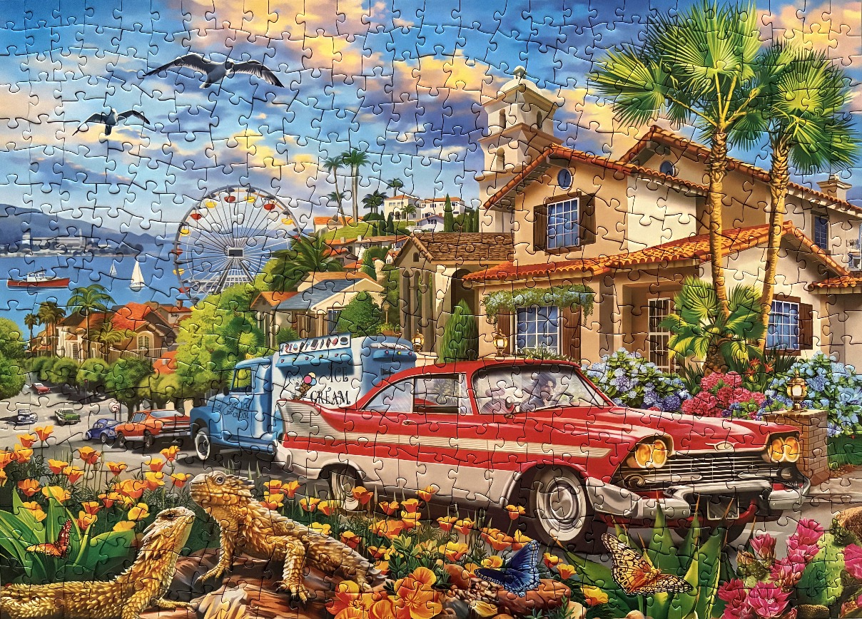A sunny seaside town scene with a red vintage car, ice cream truck, and desert-dwelling lizards in the foreground.