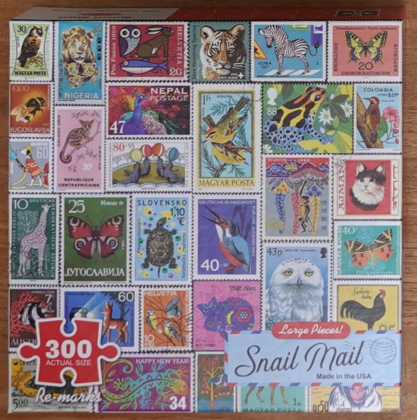 A collage of vintage postage stamps featuring various animals, birds, insects, and wildlife.