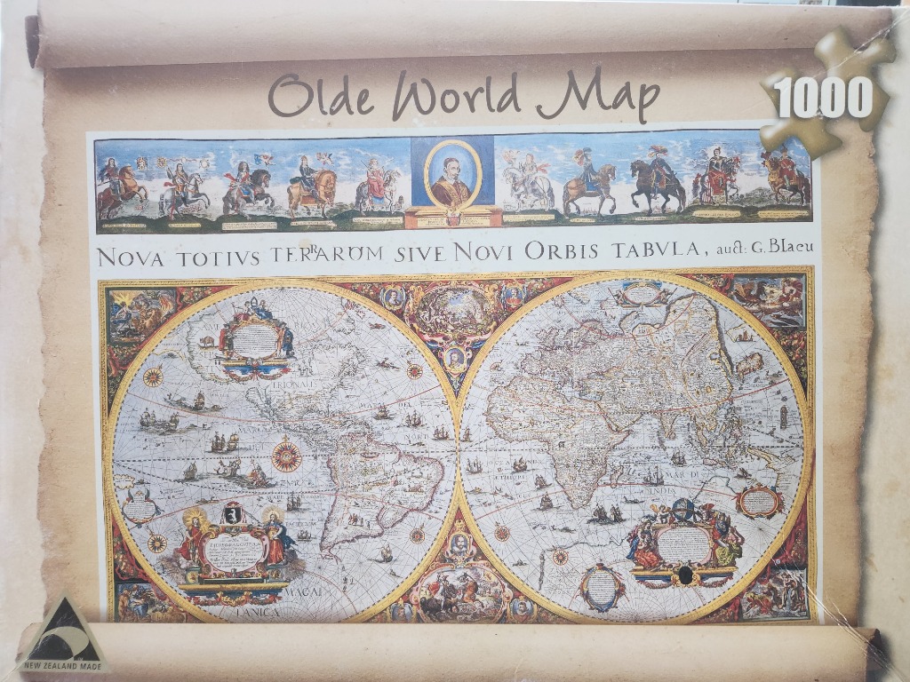 A vintage-style double-hemisphere world map featuring decorative cartouches and figures on horseback.