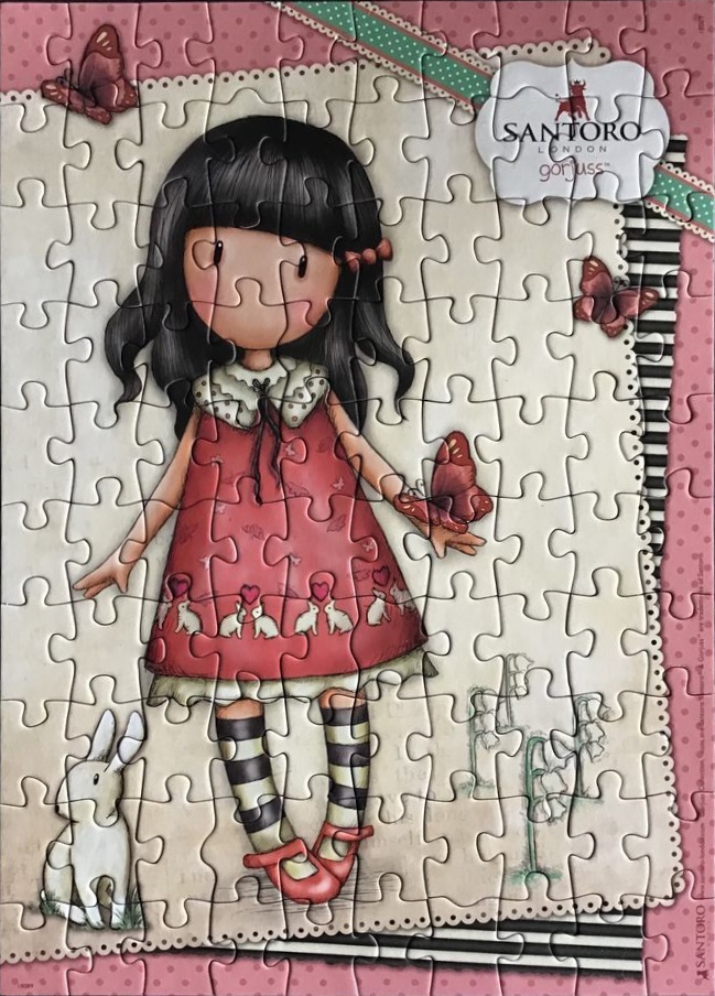 A whimsical illustration of a girl with black hair wearing a red dress and striped socks, accompanied by a small rabbit.
