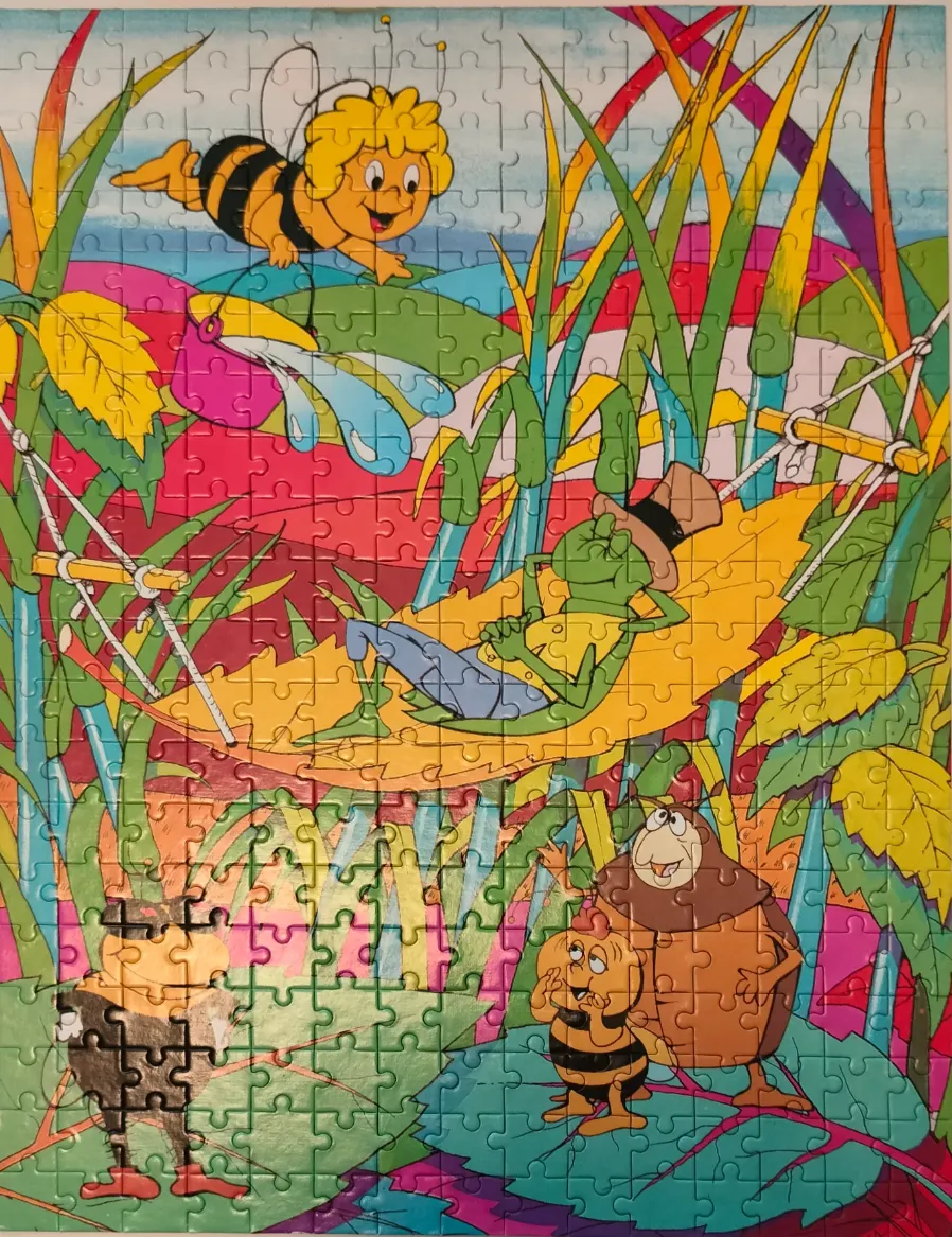 Animated characters Maya the Bee, Flip the grasshopper, and friends in a vibrant forest scene.