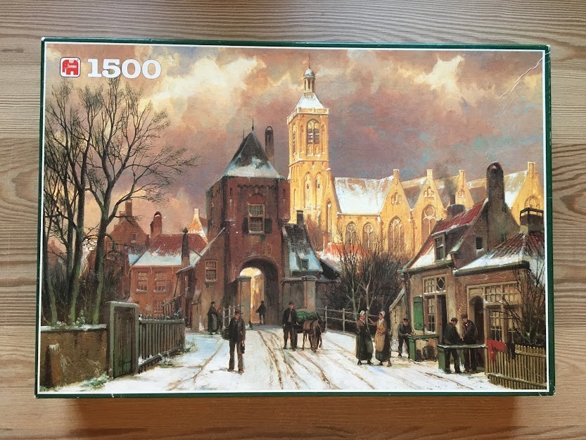 An oil painting of a snow-covered Dutch village with a prominent church tower at sunset.