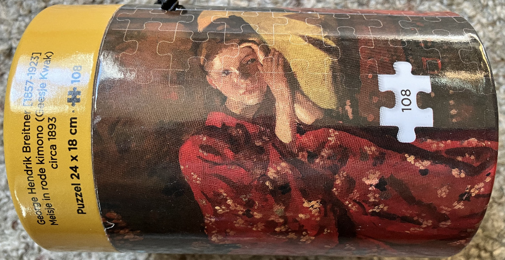 A reproduction of the painting Girl in a Red Kimono by George Hendrik Breitner.