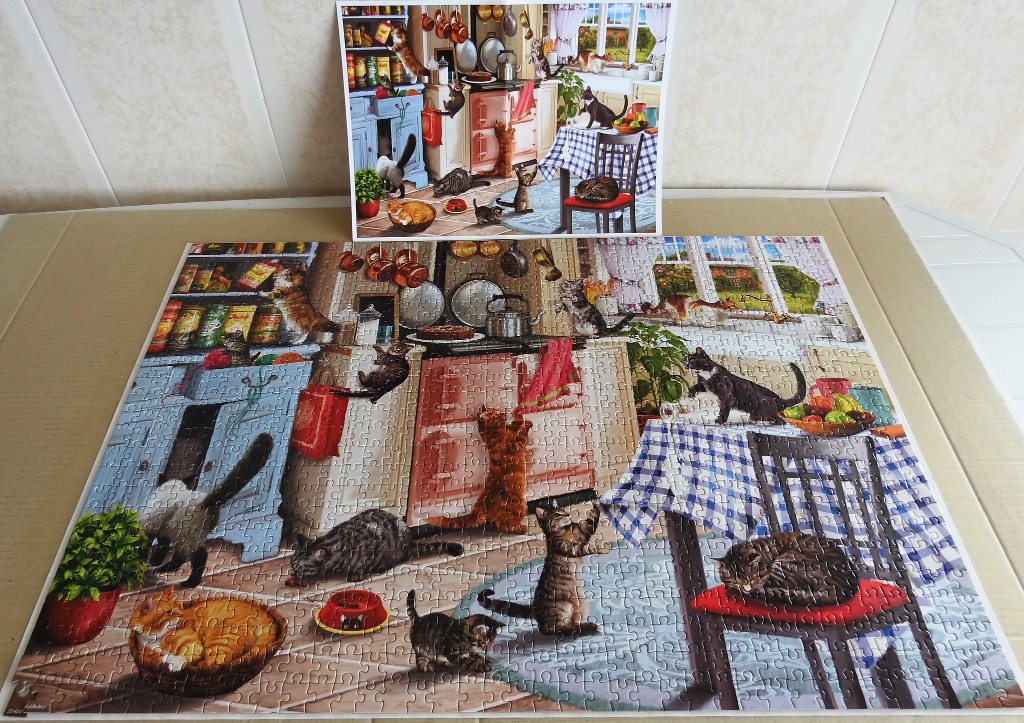 A kitchen interior filled with many cats in various activities.