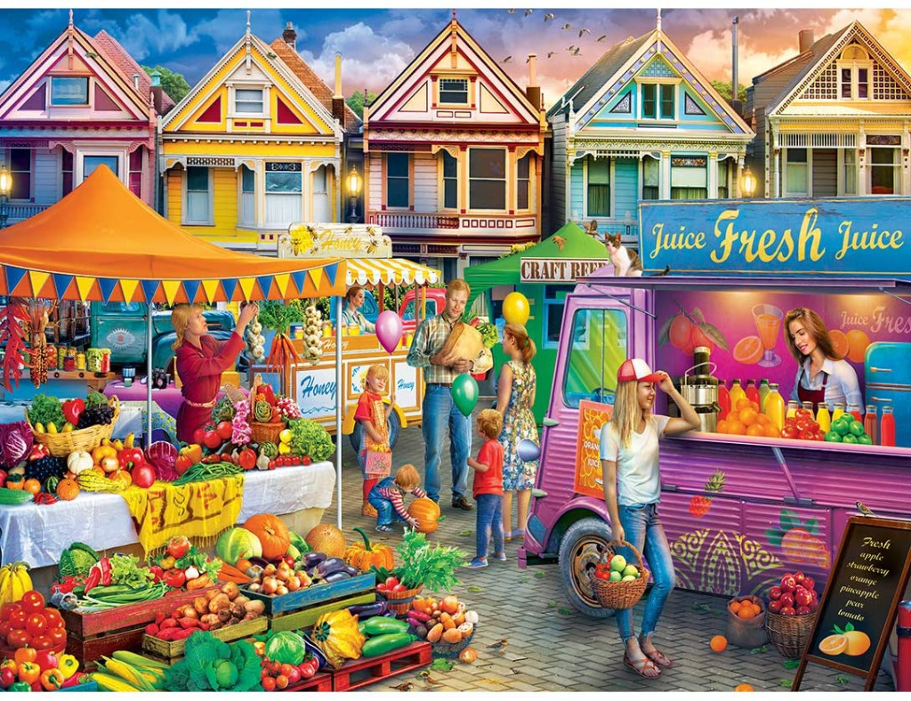 A lively outdoor market scene featuring Victorian houses in the background and stalls with fresh produce and juice.