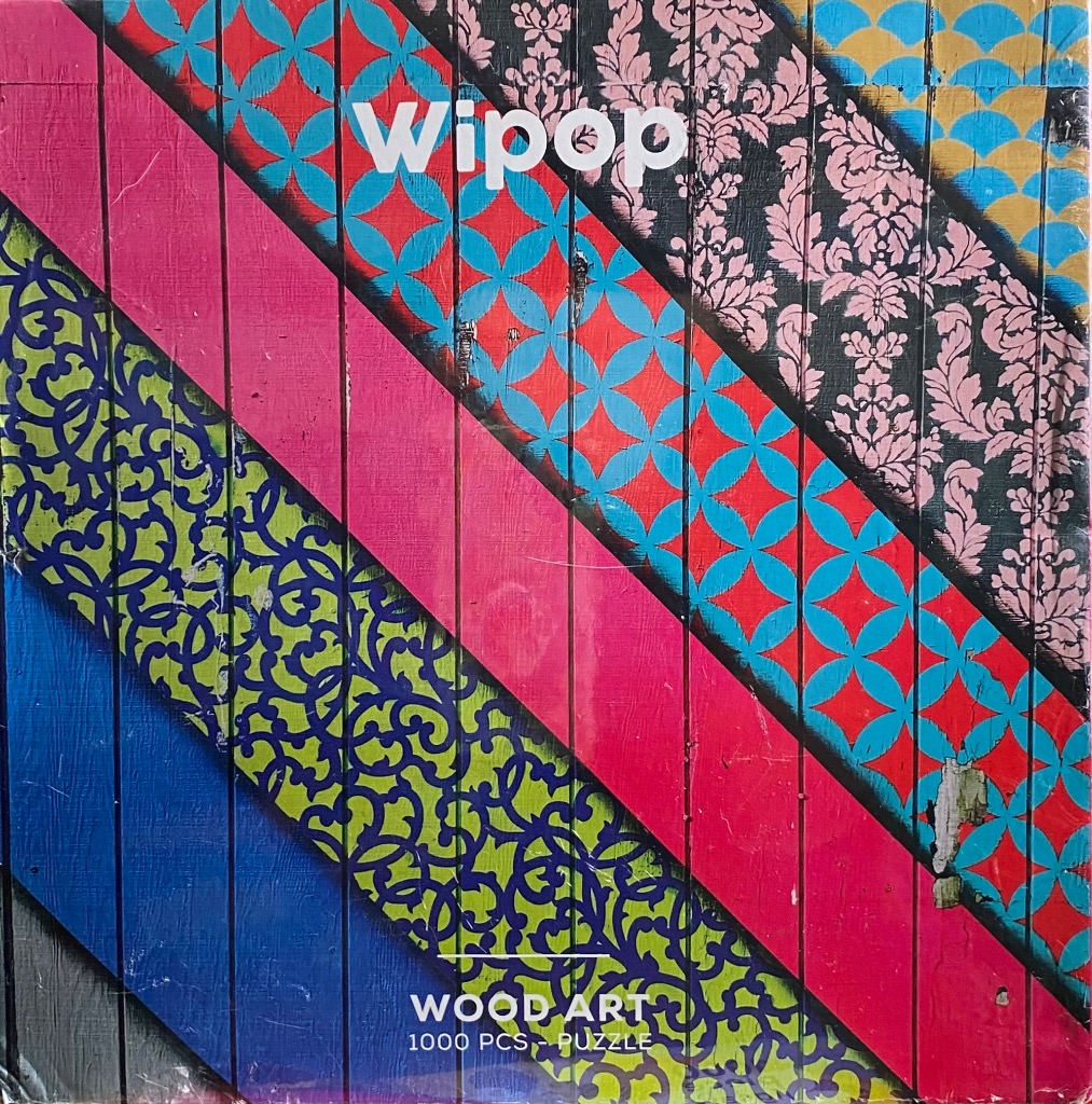 Abstract design with diagonal stripes of varying patterned textures on a vertical wood grain background.